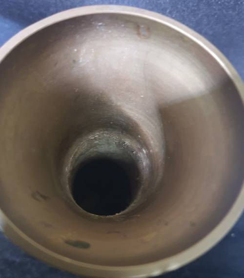 A VINTAGE BRASS WINE INGOT AND A BRASS VASE SOLD AS IS
