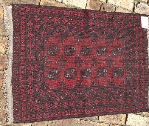 A VINTAGE PERSIAN CARPET USED DIAMENSIONS 42X32 INCHES APPROXIMATELY, IT IS A FAIRLY GOOD CONDITION