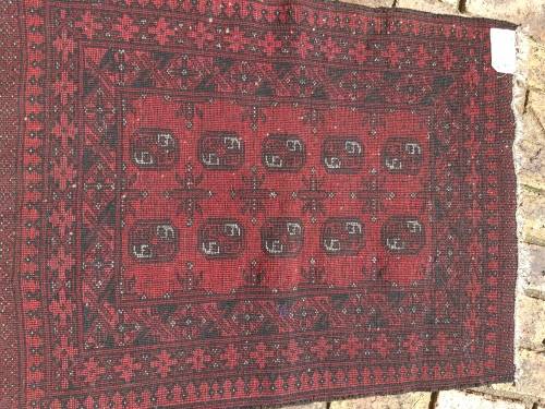 A VINTAGE PERSIAN CARPET USED DIAMENSIONS 42X32 INCHES APPROXIMATELY, IT IS A FAIRLY GOOD CONDITION