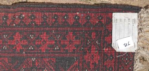 A VINTAGE PERSIAN CARPET USED DIAMENSIONS 42X32 INCHES APPROXIMATELY, IT IS A FAIRLY GOOD CONDITION