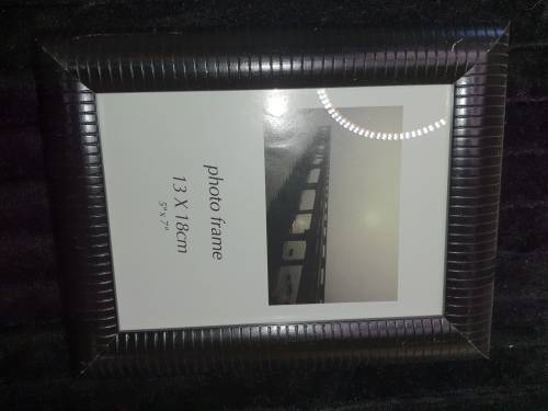 A COLLECTION OF PICTURE FRAMES SOLD AS IS