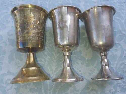 A COLLECTION OF JEWISH WINE SILVER PLATED INGOTS SOLD AS IS