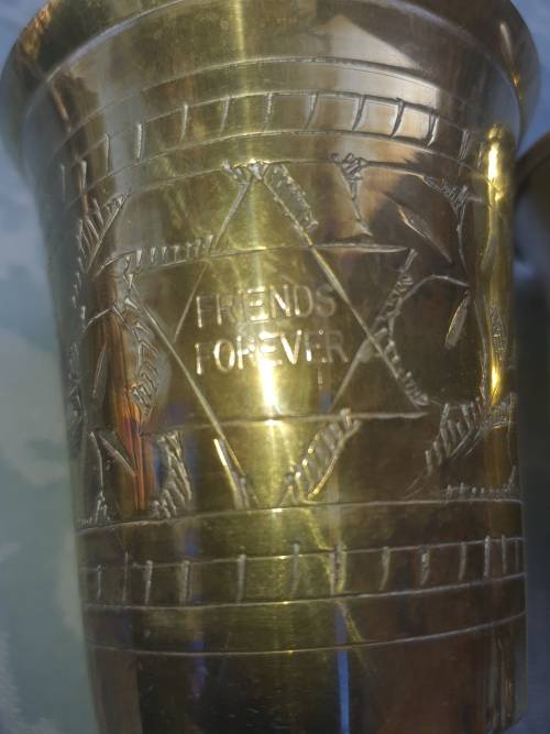 A COLLECTION OF JEWISH WINE SILVER PLATED INGOTS SOLD AS IS