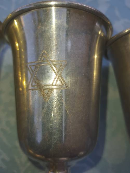 A COLLECTION OF JEWISH WINE SILVER PLATED INGOTS SOLD AS IS