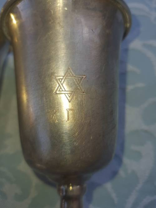 A COLLECTION OF JEWISH WINE SILVER PLATED INGOTS SOLD AS IS