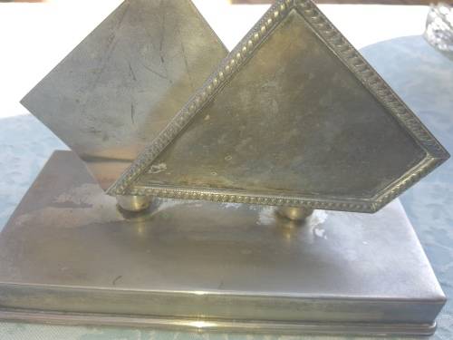 A VINTAGE STAINLESS STEEL SERVIETTE HOLDER