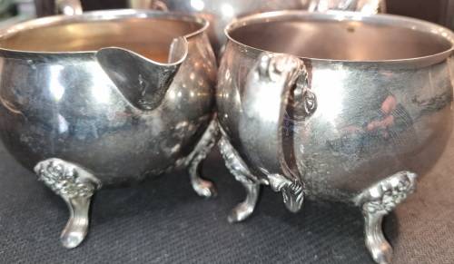 A VINTAGE SILVER-PLATED VICTORIAN STYLE TEA JUG, MILK AND SUGAR BOWL SET SOLD AS IS