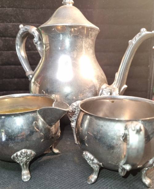 A VINTAGE SILVER-PLATED VICTORIAN STYLE TEA JUG, MILK AND SUGAR BOWL SET SOLD AS IS