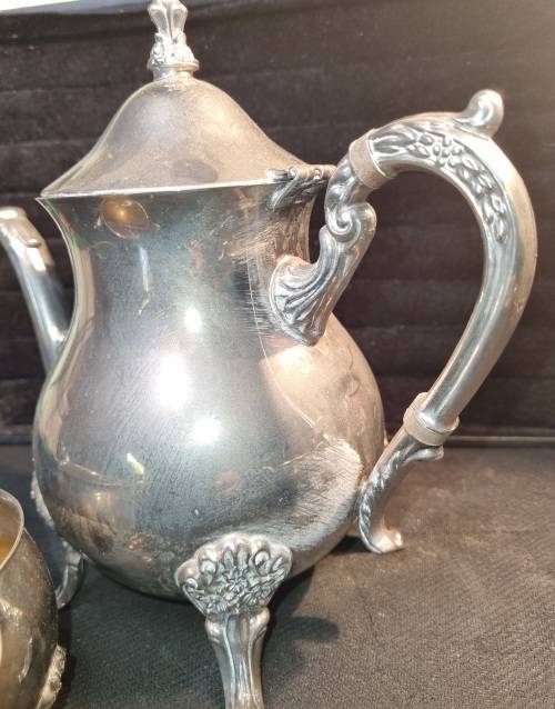 A VINTAGE SILVER-PLATED VICTORIAN STYLE TEA JUG, MILK AND SUGAR BOWL SET SOLD AS IS