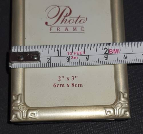 TWO VIRTUALLY BRAND-NEW SMALL PICTURE FRAMES SOLD AS IS