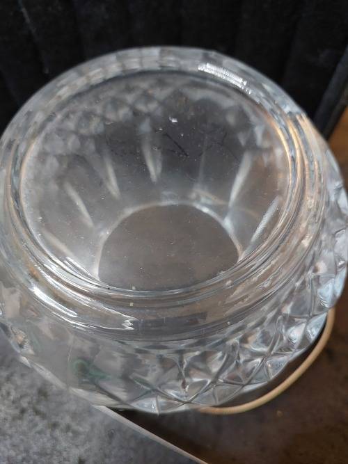A FANCY CRYSTAL GLASS TYPE ICE BUCKET AND TONGS SOLD AS IS