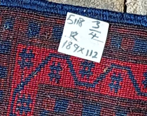 A BEAUTIFUL RED AND BLUE PERSIAN RUG