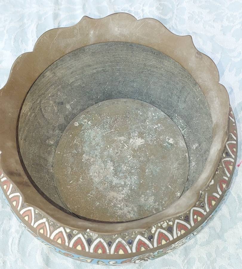 AN ANTIQUE BRASS PLANTER WITH ORNATE DESIGN SOLD AS IS