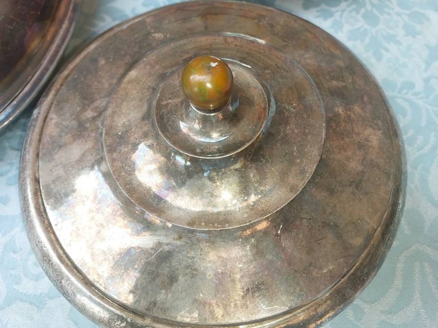 A COLLECTION OF ANTIQUE SILVER PLATED TURINES AND A SERVING TRAY