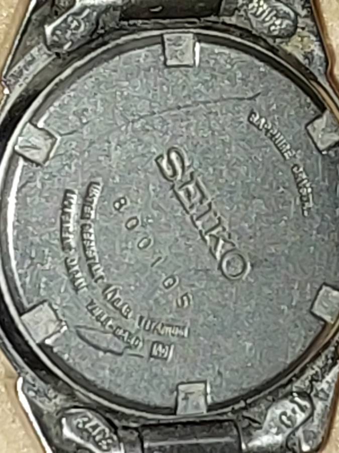 A VINTAGE SEIKO LADYS SAFFIRE CRYSTAL DATE  TITANIUM