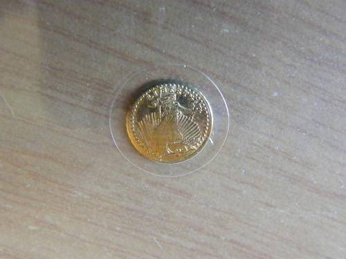 A VERY SMALL UNITED STATES LIBERTY GOLD COIN SEALED IN A SLEEVE. STARTING @ CRAZY R1