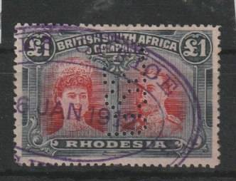 Rhodesia BSAC 1910 KGV Double Head perf 14 £1 car-red and bl-blk with gash in ear flaw fiscally used