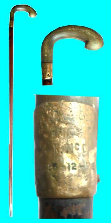 Antique walking stick made out of wood with a whitish wooden handle