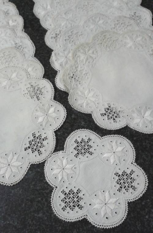 Two dozen round vintage linen Lefkara lace doilies/table mats