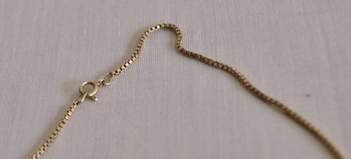 The Gold Bullion Collection 22 carat gold plated bar pendant and chain designed by Royston Lamond