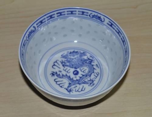 Vintage Chinese Porcelain Translucent Rice Grain Blue and White Dragon Bowl