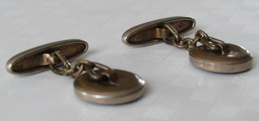 Vintage Art Deco mother of pearl and onyx cufflinks marked `Gilt`