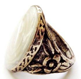 Gold tone fashion ring with a light yellow oval stone