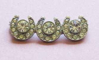 Vintage silver tone and sparkling clear stone horseshoe brooch pin