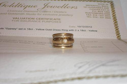NINE (9) DIAMONDS "TUBE, PAVE & GYPSEY" SET IN 9CT GOLD DRESS RING (VALUATION CERT. INCL) NO INFLATE
