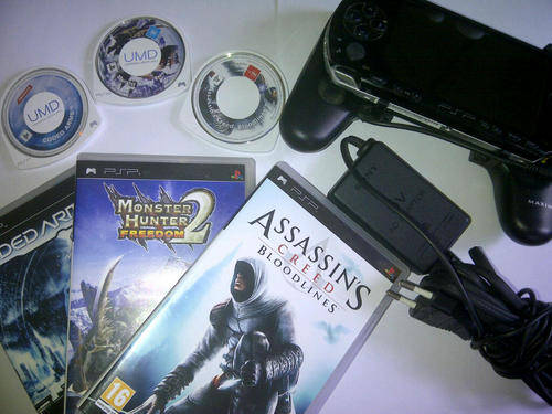PSP + 3 Games + Extra Battery/Handle accessory.