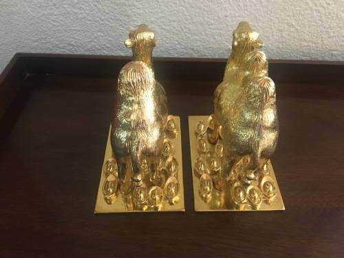 A Pair of Golden `World of Feng Shui` Camels