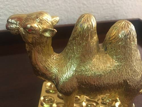 A Pair of Golden `World of Feng Shui` Camels