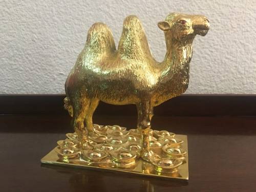 A Pair of Golden `World of Feng Shui` Camels