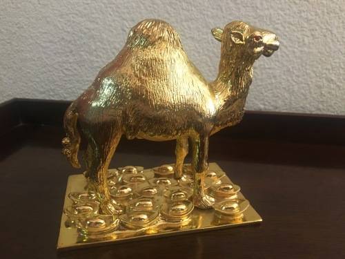 A Pair of Golden `World of Feng Shui` Camels