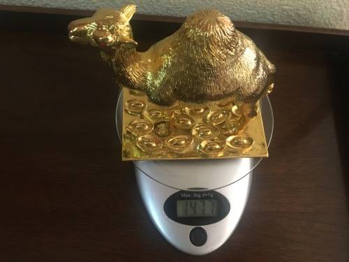 A Pair of Golden `World of Feng Shui` Camels