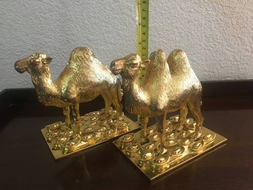 A Pair of Golden `World of Feng Shui` Camels