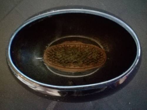 Stunning oval navy blue vase with metal flower frog