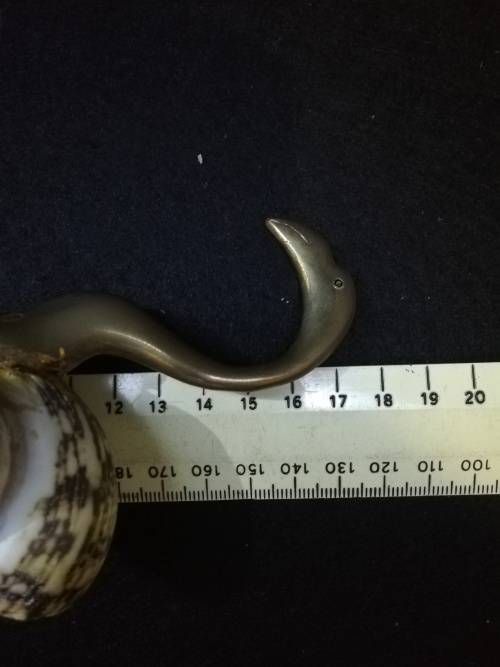 Brass bird with shell body