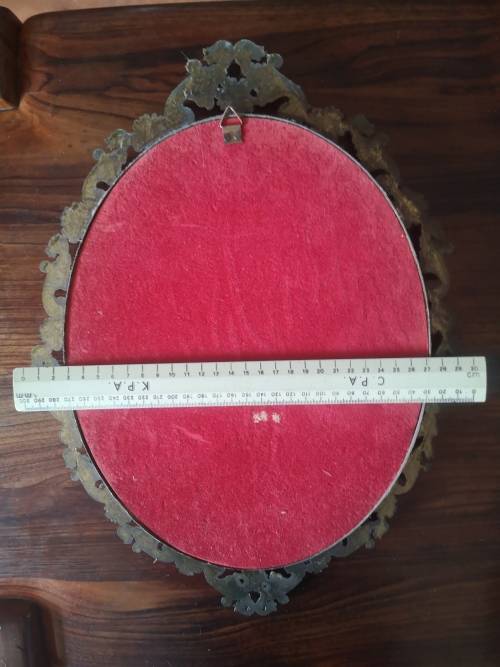 Vintage ornate metal frame with concave glass! Look!