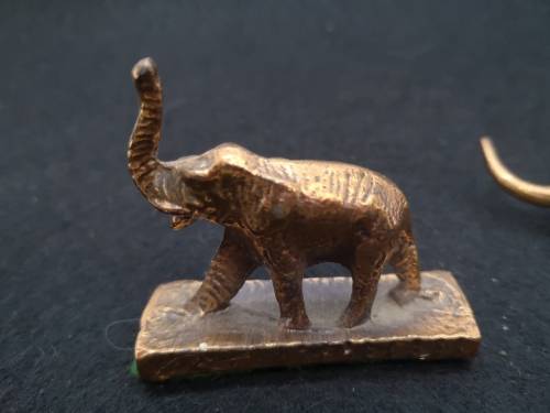 Mini bronze elephant and a cat