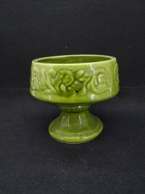 Footed green ceramic vase