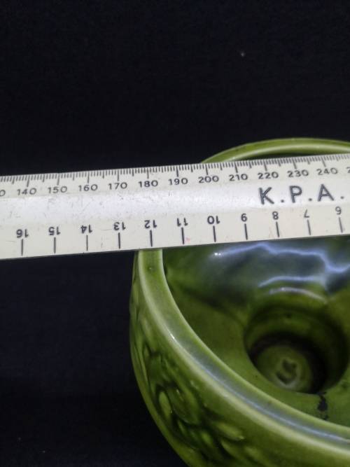 Footed green ceramic vase