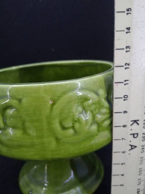 Footed green ceramic vase