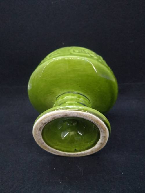 Footed green ceramic vase