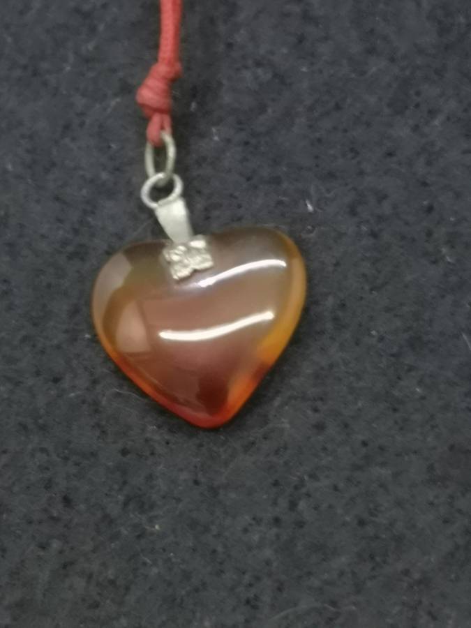 Semi-precious stone heart pendant on a string