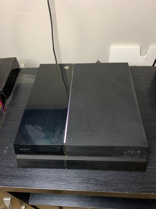 PlayStation 4 Original in original box with both a wired and wires less controller. Games included.