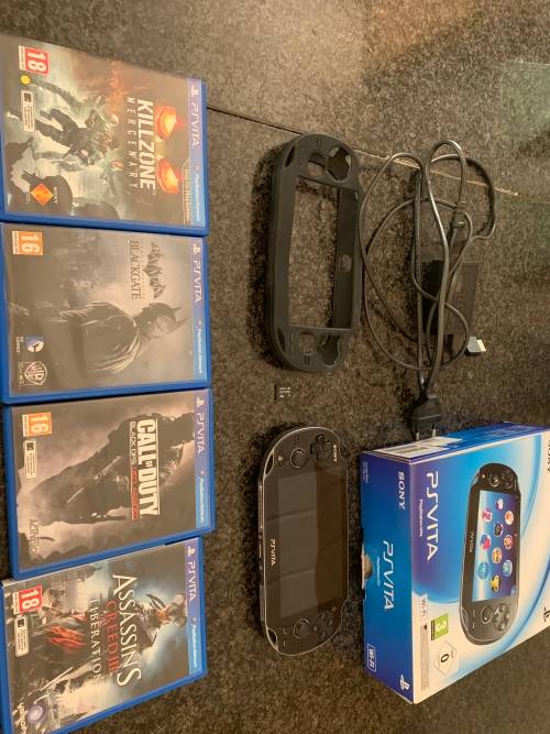 Sony PS Vita WiFi With 4Gb Memory Stick And Cover In Original Box + 4 Games.