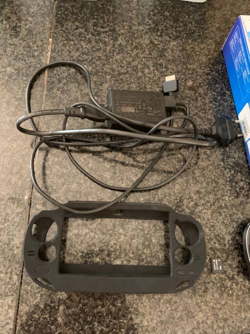 Sony PS Vita WiFi With 4Gb Memory Stick And Cover In Original Box + 4 Games.