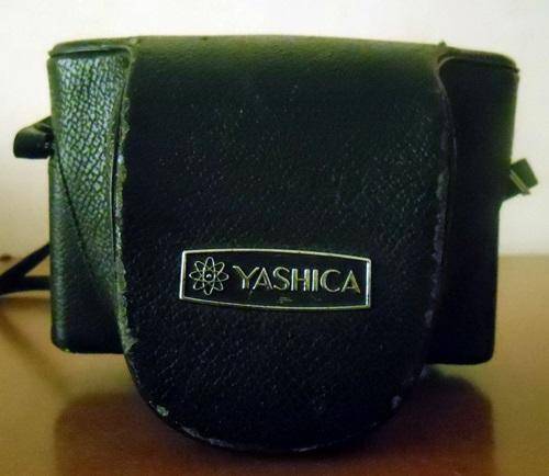 ## Yashica Film camera with pouch (not sure if in working order) ##