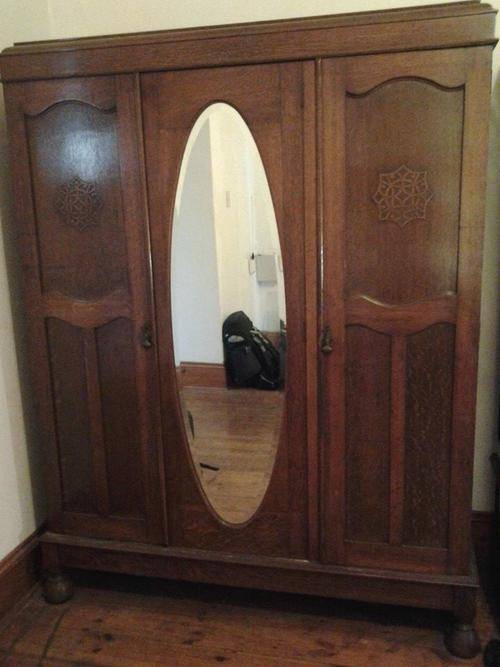 a gorgeous large solid oak wardrobe - 3 doors -1 mirrored